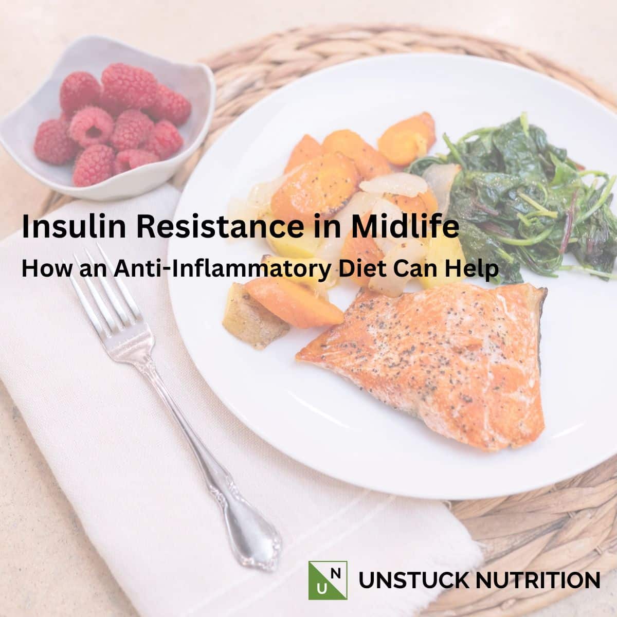 Salmon with roasted vegetables, sautéed greens, and raspberries illustrating an anti-inflammatory meal pattern for insulin resistance in midlife.