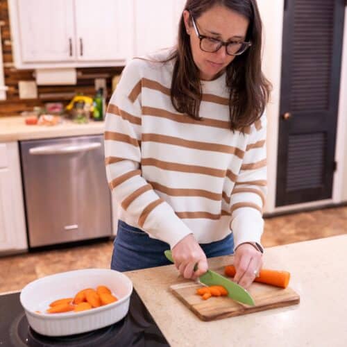 Dietitian preparing anti-inflammatory foods in the kitchen for hot flash support.