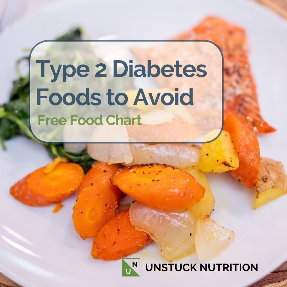 Salmon with roasted carrots, potatoes, and onions and sautéed greens on a white plate, an anti-inflammatory meal for type 2 diabetes.